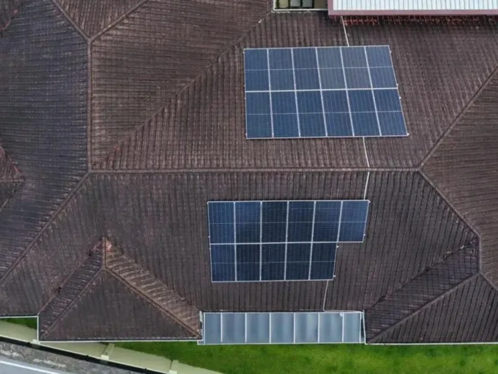 Top-down view of a 23 panel solar system on a roof at Taman Hillview, Kuching
